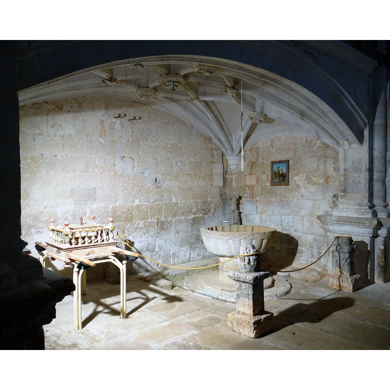 the medieval font in the northeast corner, beneath the gallery