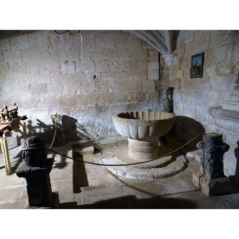 the medieval font in the northeast corner, beneath the gallery