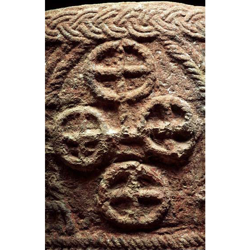the foour of them are l;inked in the shape of cross; although it is eroded the circles and crosses appear to be done in a torsade pattern