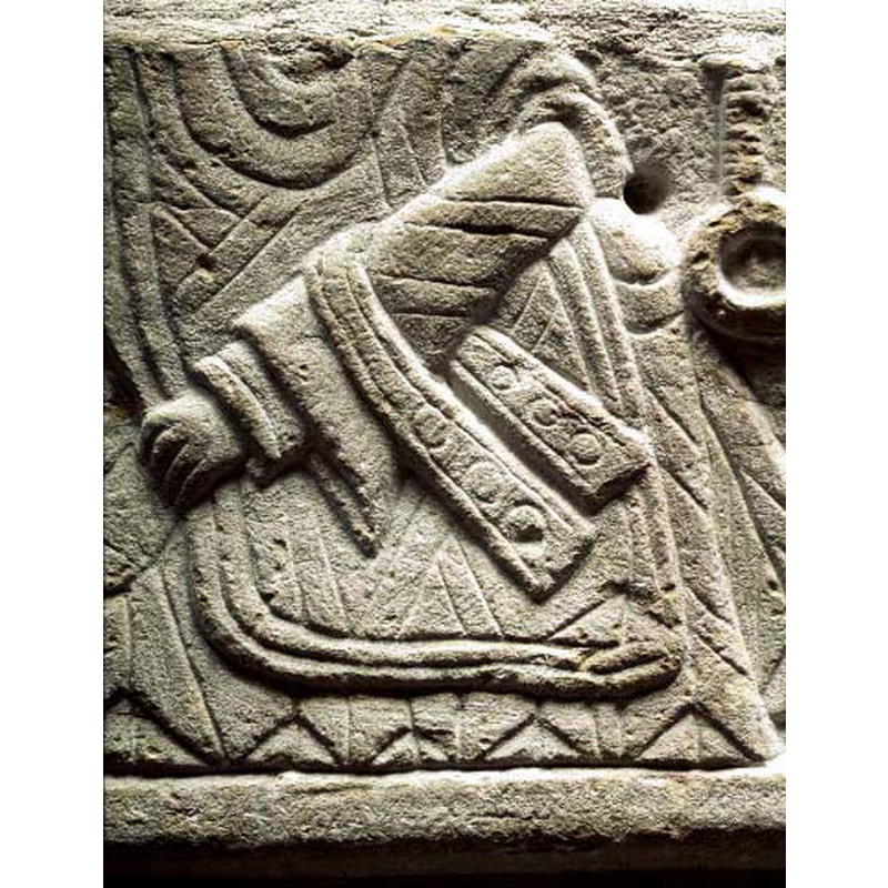 a decorated maniple hangs from the left arm of God