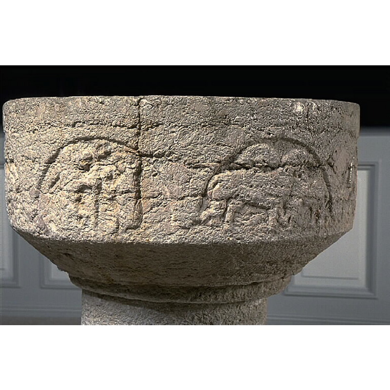 Source caption: "Enånger, gamla kyrkan [...] Dopfunt, står numera i Enångers nya kyrka." -- showing the basin of the medieval font in the new church in June 1986