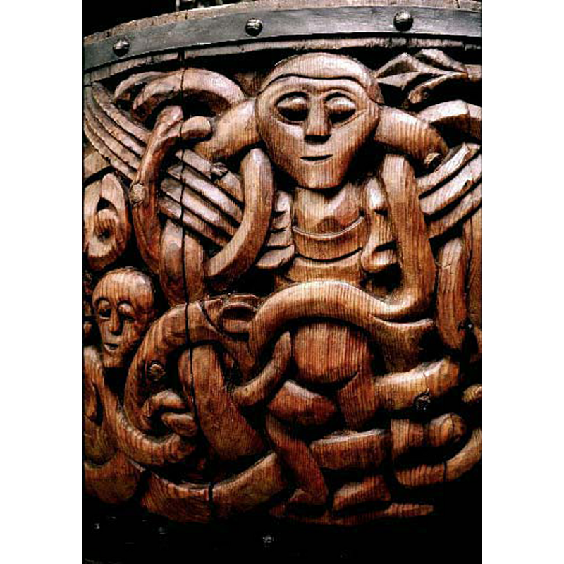 this angel is not haloed; its wings are open; there is a human face or head among the interlace, on the left of the image