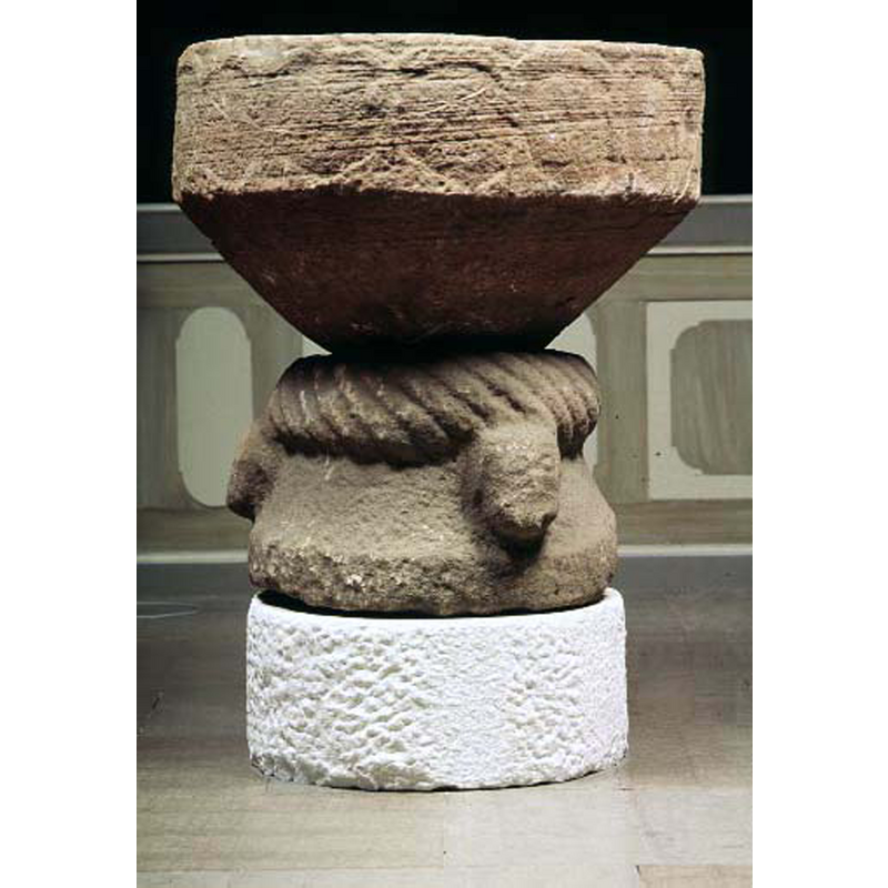 very thick and in high relief, at the top of the base