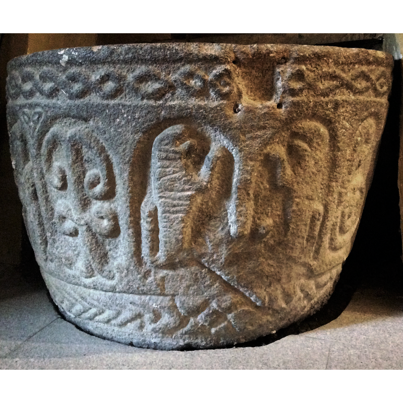 showing the large notch in the upper rim; it was probably made for an anchoring or locking mechansim for the font cover
