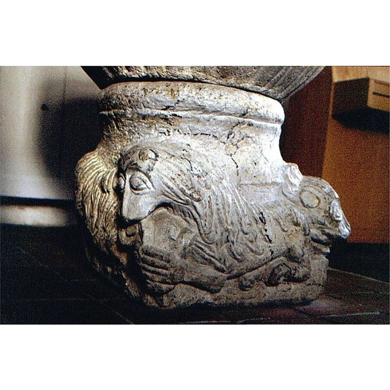 Source caption: "Blentarp kyrka i Skåne, Sverige. Blentarp kirke, døbefont" -- the lion in the centre bites the head of a ram(?), while the lion on the right bites the tail of the lion in the centre