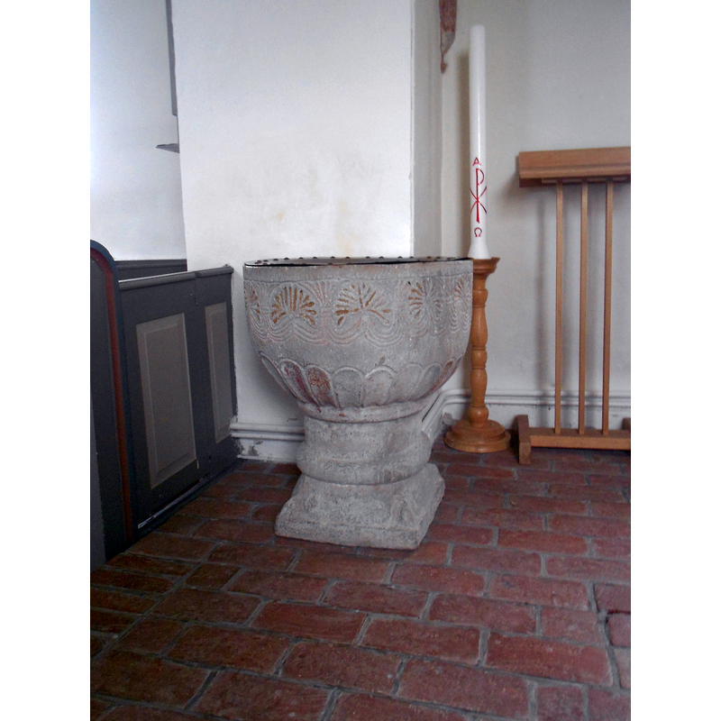 the column behind the font is the north pillar of the chancel atch