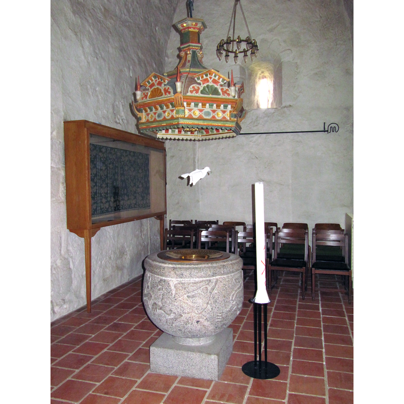 Source caption: " Dopfunt i tornets bottenvåning i Fjälkinge kyrka" -- a rare mainland sight: a canopy over the font