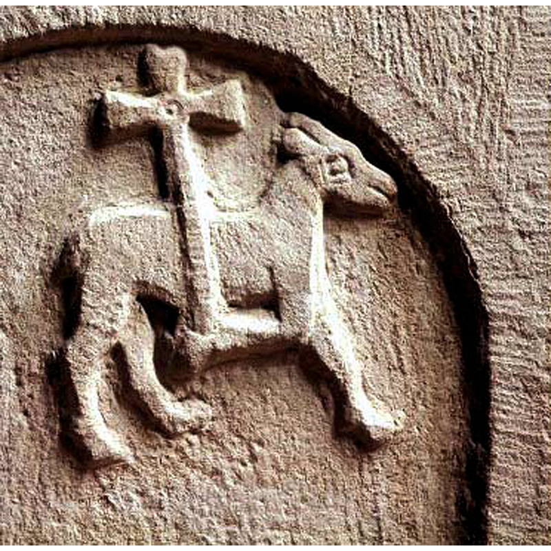in the usual pose, carrying the cross on a bent front leg