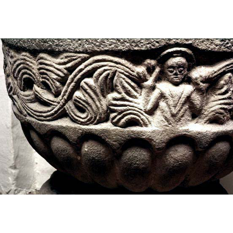 a stance repeated in the fonts of this design and group, whether the figure is Christ or a bishop