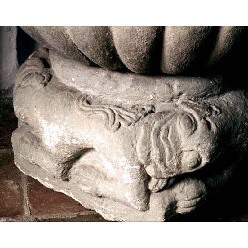 each lion bites the hind quarters of the lion ahead