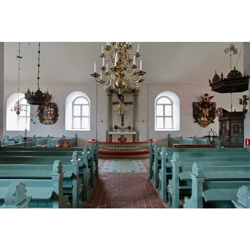 the font is not visible here but its canopy is visible in the left side, across from the pulpit, the design of which is very similar to that of the canopy -- at the far end is the crucifix, a location that was occupied by the originl pulpit before the re-orientation of the church