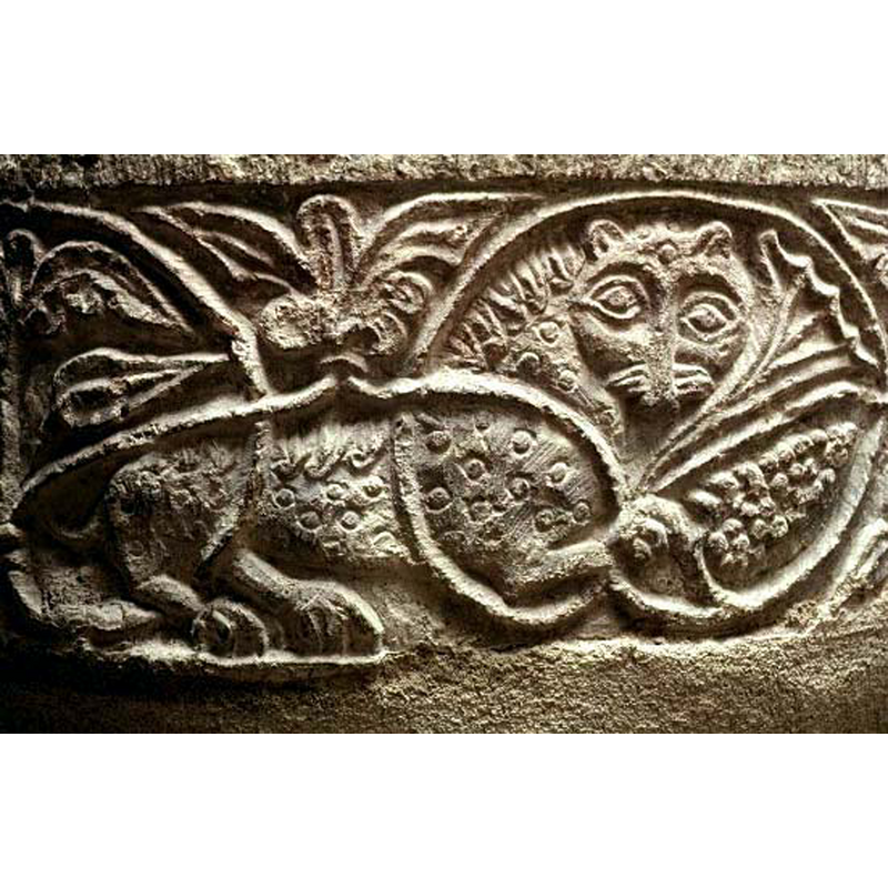 one of several lions caught in the running vine; this one passant to the right