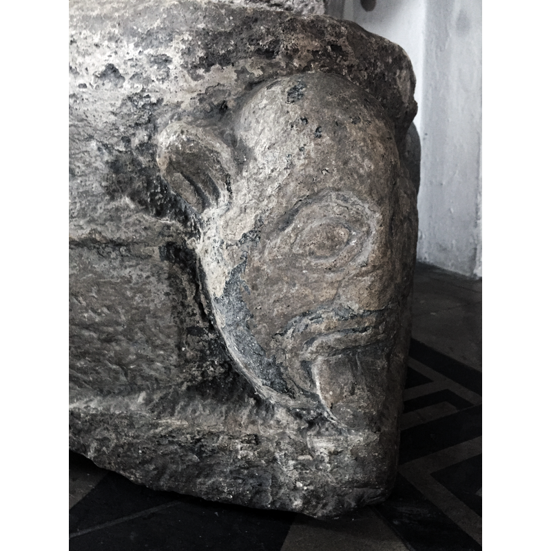 monkey? -- Source caption: " Baptismal font in Oxie Church, detail"