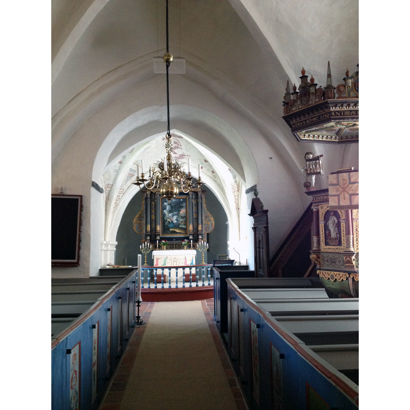 the position of the font is marked here by the tall Paschal candle on the left side of the centre aisle, far [east] end