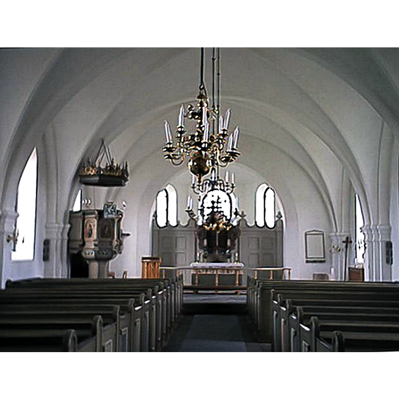 Source caption: "Insidan av sv:Rörums kyrka" -- the top of the medieval baptismal font is discernible at the far [east] end, right [south] side