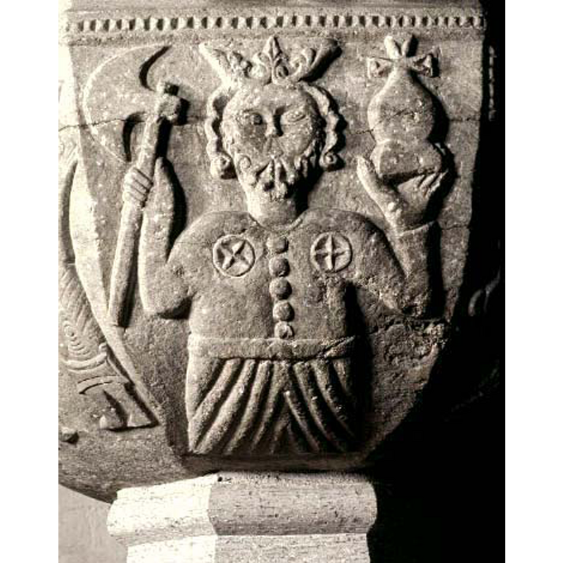 the figure, identified as St. Olav in various sources, holds the ax on the right hand and a cross-topped objet on the left