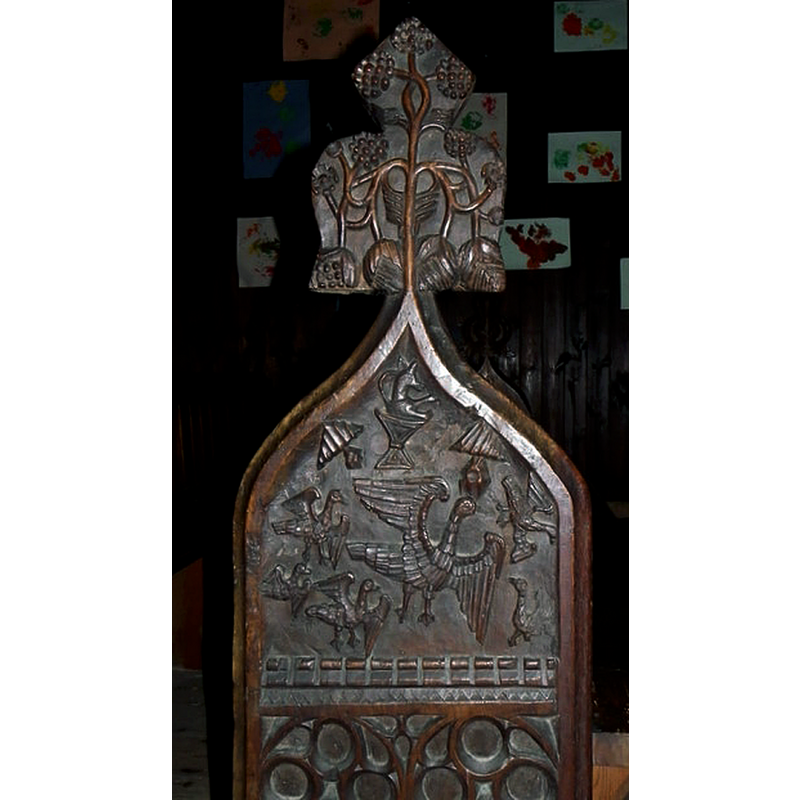 Source caption: "Detail, Church of St Peter and St Paul. The bench ends and poppy-heads are highly decorated. This bench end depicts a fox preaching to geese."