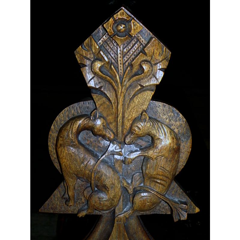 Source caption: "Poppy-head, Church of St Peter and St Paul. Poppy-heads (from the French word 'poupees') are finials to bench ends."