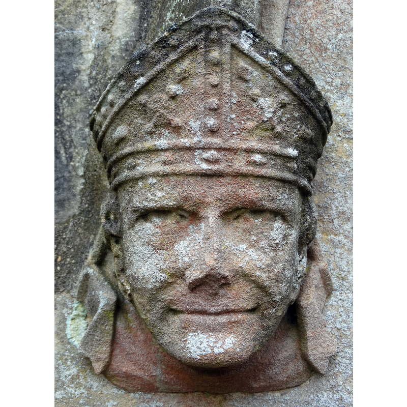 Source caption: "Stone Face. Carved by the doorway to St Margaret's Church in Somerby"