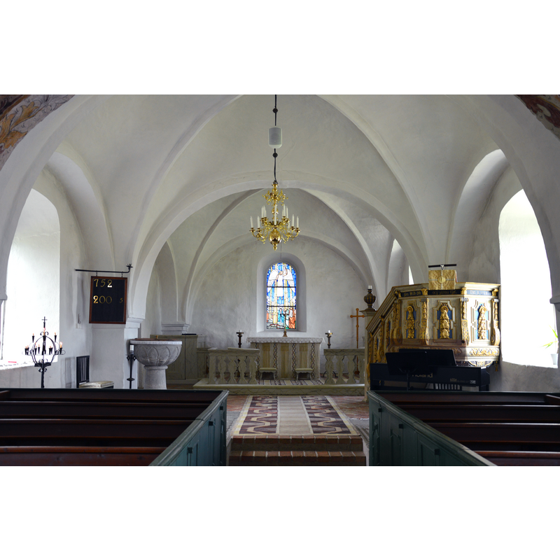 Source caption: " Interior, Skarhult church, Skarhult, Eslöv, Sweden." -- showing the baptismal font on the left, by the north pillar of the chancel arch