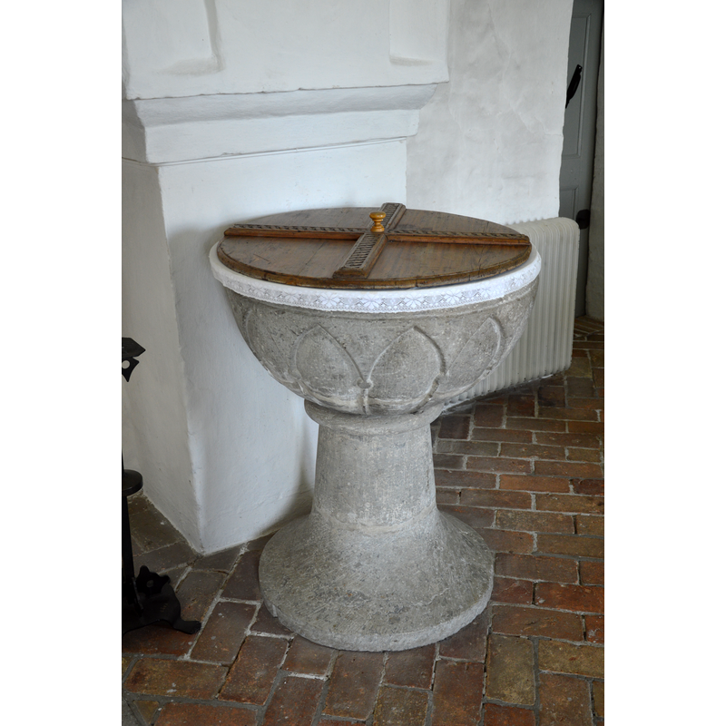 Source caption: "Baptismal font, Skarhult church, Skarhult, Eslöv, Sweden." -- standing against the north pillar of the chancel arch