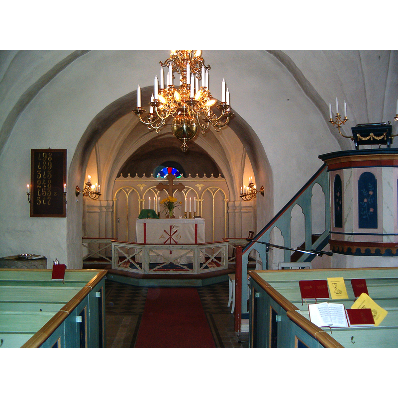 partially showing the font and baptismal dish on the left, by the psalm board