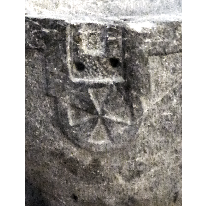 the large knotch carved above it was probably made to instal a lock for the cover