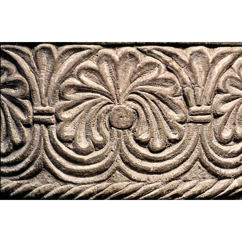 the usual pattern in which tendrils issuing from below fill the upper spandrels between the linked palmettes