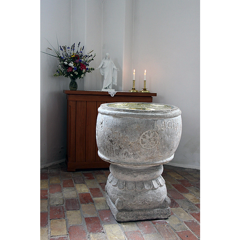 the medieval font originally from the demolished church of nearby Flackarp, now in the new parish church of Uppåkra