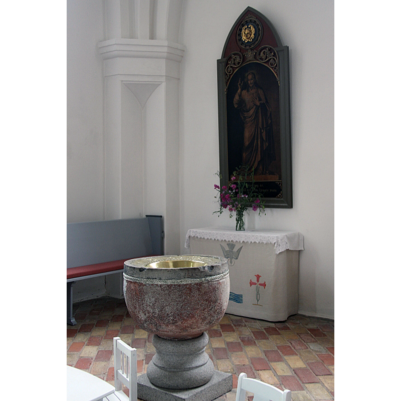 the baptismal font originally from the demolished medieval church of Uppåkra, now in the new church