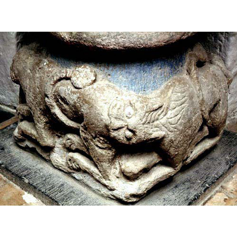 the lion at the back bites the hind quarters of the lion in front