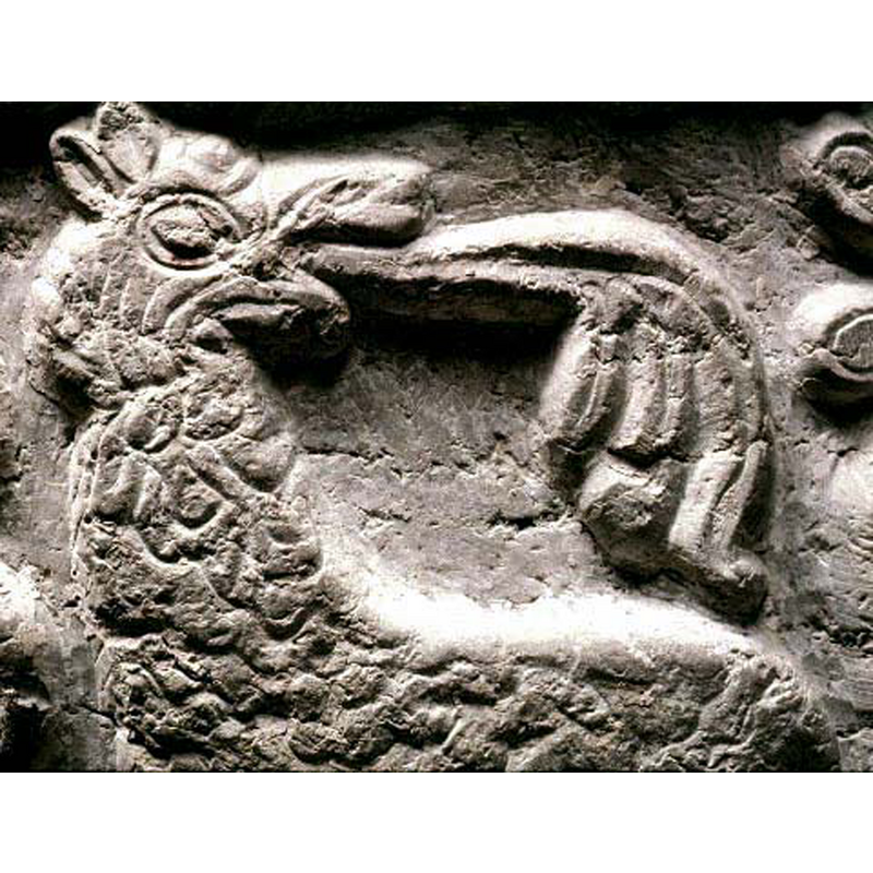 the pattern covering its body makes it look like an Andean llama, but it is more likely that it may have been intended to represent a lion