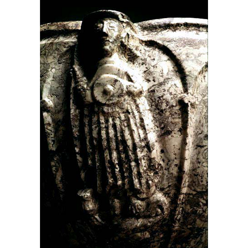 standing figure holding small round shield(?) in his left hand; stands on a dragon; the right hand holds an unidentified object [a spear?] that may have been broken or damaged; no halo evident -- SHM entry caption: "gestalt med sköld stående på drake (St Mikael?)"; Tynell mentions a spear in his right hand