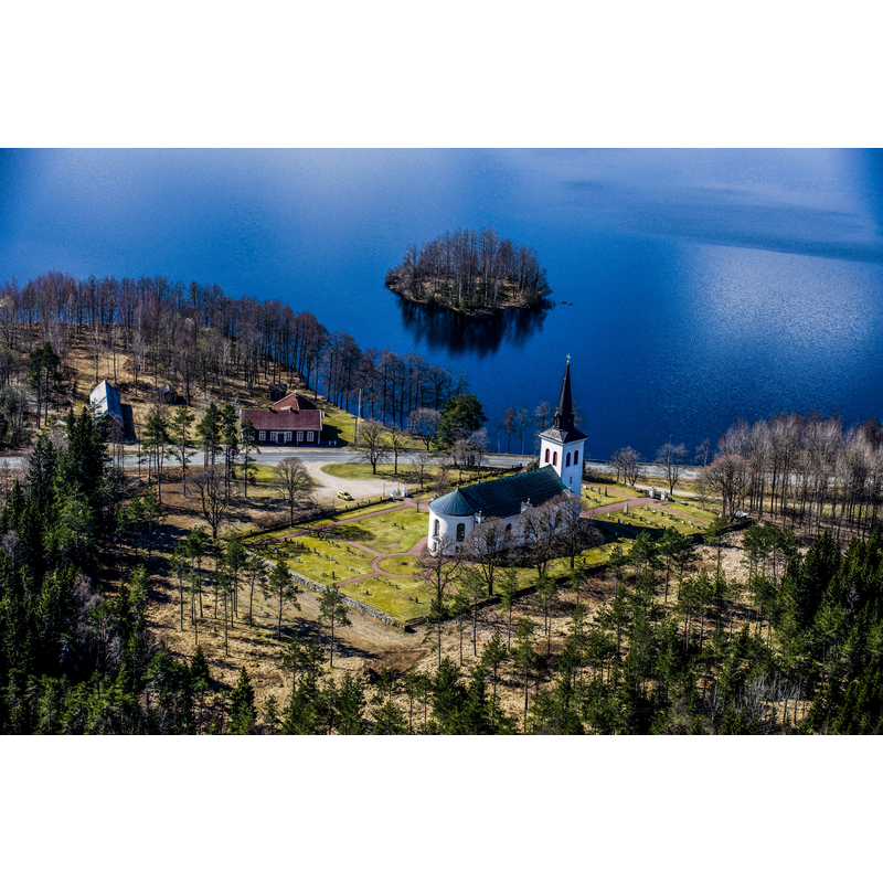Source caption: "The Almesåkra church from the air" -- the present church building dates from 1870