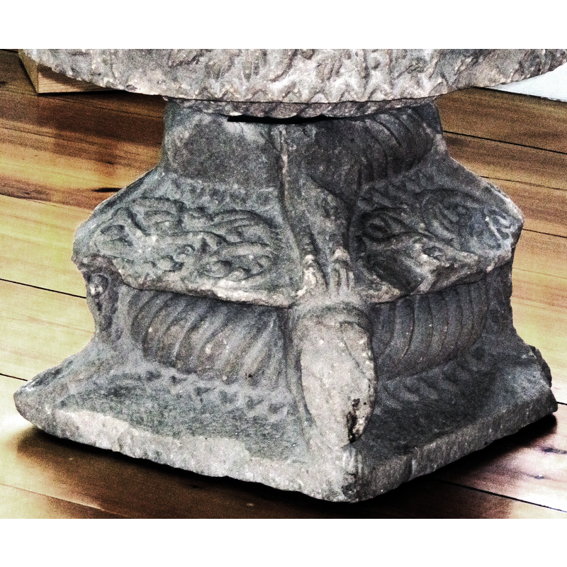 only some front legs remain of whatever animals were carved atop the mid section of the base