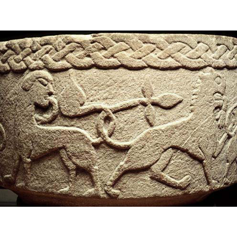 the SHM caption reads: "lejon, ett med antropomorfa drag" but it hard to identify them both as lions; the animal on the left, with human-like head could be meant as a centaur, but the body is rather feline; passant-regardant; it has a serpent issuing from its mouth -- the animal on the right, passant to the right, is feline of body and head, and has a magnificent floriated tail end; a human arm dangles from its maw