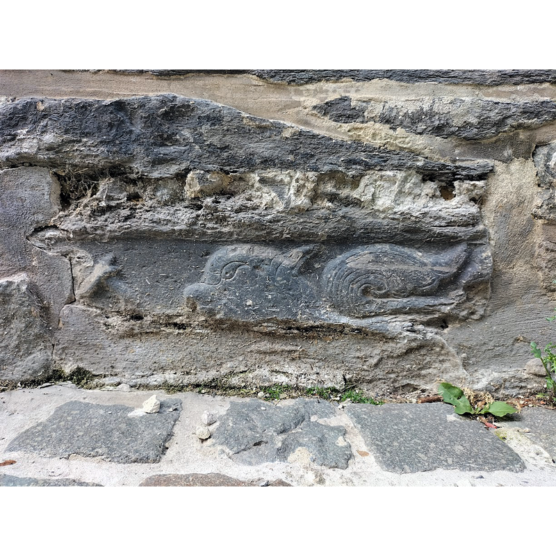 now built into the exterior south wall of the church