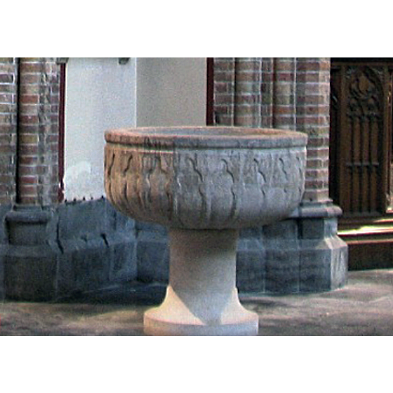 the Gotland Paradise font in the Bruges church; the pedestal base is a later replacement