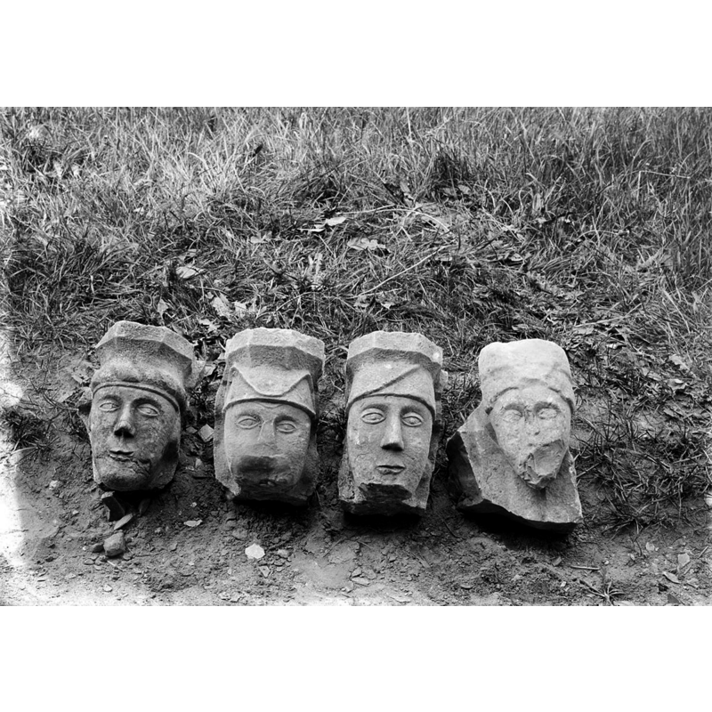 Source caption: "Rooms-Katholieke Kerk: voormalig doopvont, fragment" -- view of some of the font fragments of the medieval baptismal font found buried nearby