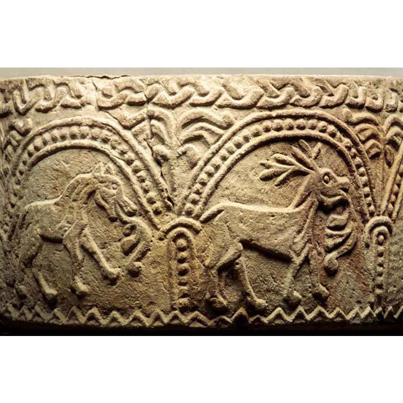 in the right arch, passant to the right -- is it being chased by the dog in the previous arch?