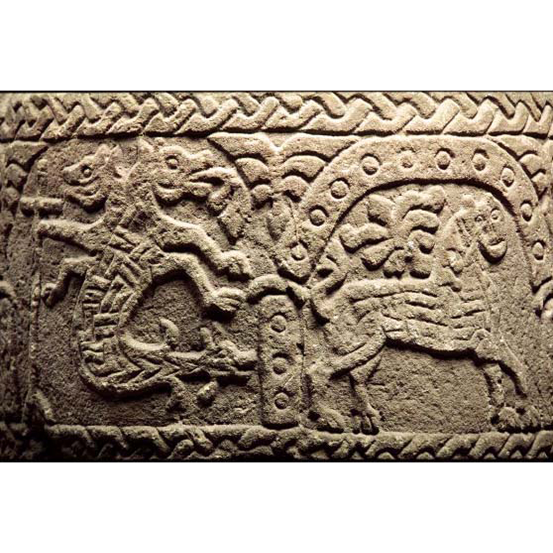 in the left arch; the holding of a cross by a three-headed monster is rather unusual