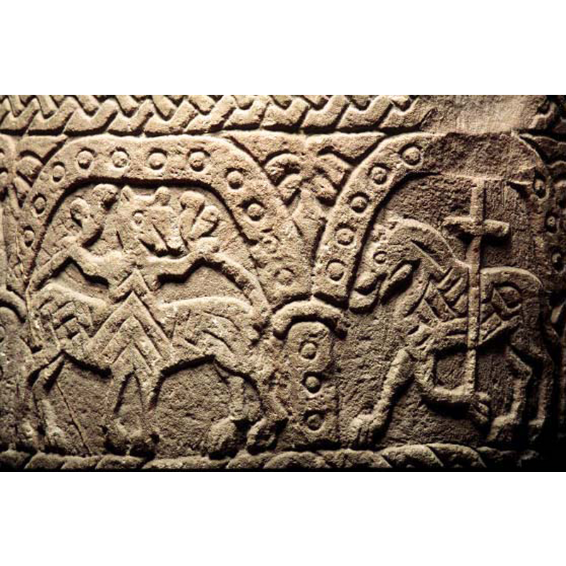 in the right arch, passant to the left; the patterned body and the tongue out are interesting for this symbol