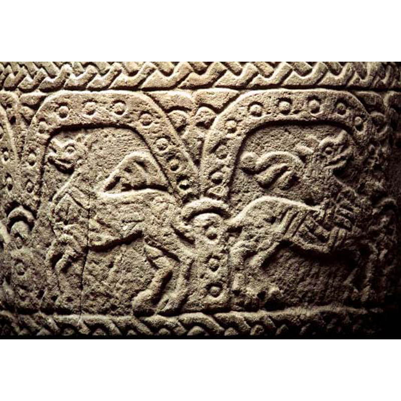in the left arch, passant to the left; the floriated motif is neither the tongue nor the tail here -- identified as a lion in the SHM caption