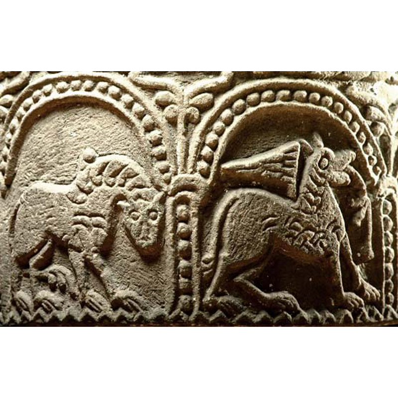 in the right arch; passant to the right -- idenfied as a lion in the SHM caption