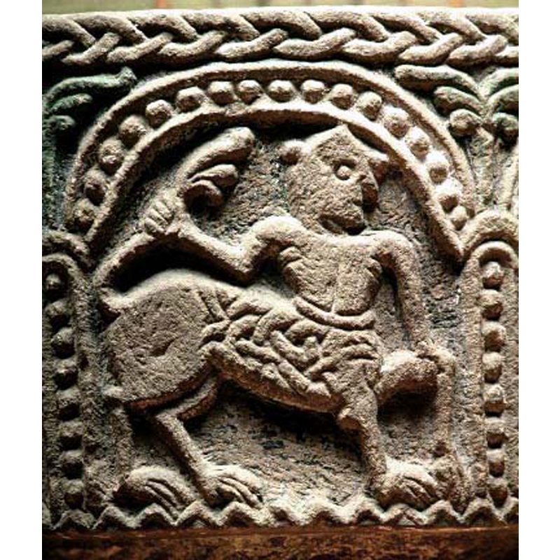 passant to the right; front half of the animal body is patterned with an interlace