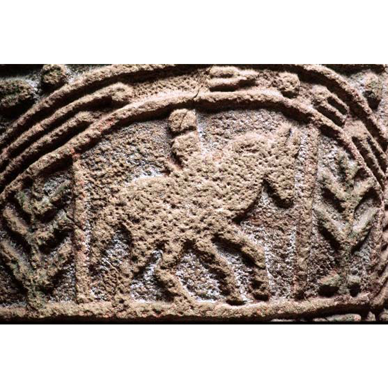 passant to the right, with a plant or tree separated by a vertical pipe or column at each side -- notice the assorted motifs decorating the arch-head