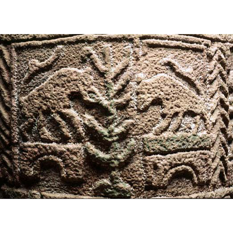 an odd arrangenment: the tall plant or tree (Tree of Life?] in the centre; on each side a quadruped stands on a bridge or arch facing the tree -- the SHM entry captions the image: "motställda fyrfotingar kring ett livsträd"