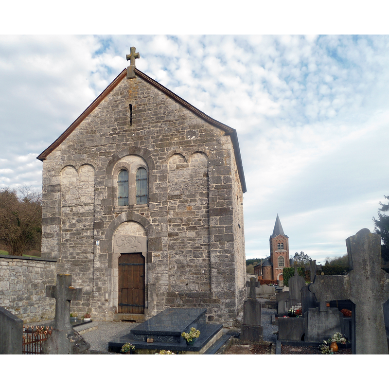 Source caption: "Chapelle romane de Vieuxville" -- the west end visible here incorporates the tympanum of the original façade; at the back is the modern church of Vieuxville