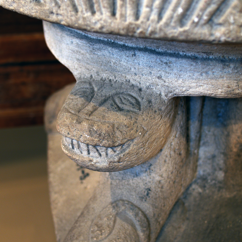 one of four; a pair of them show their teeth in a smirk