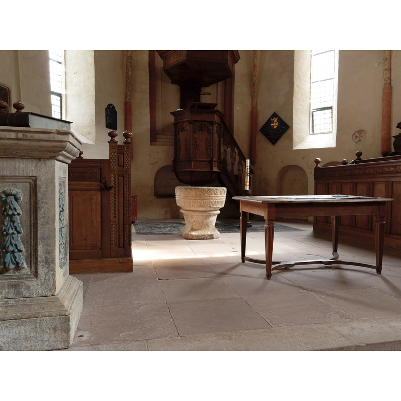 as is common in Durch Reformed churches, the font stands near the pulpit
